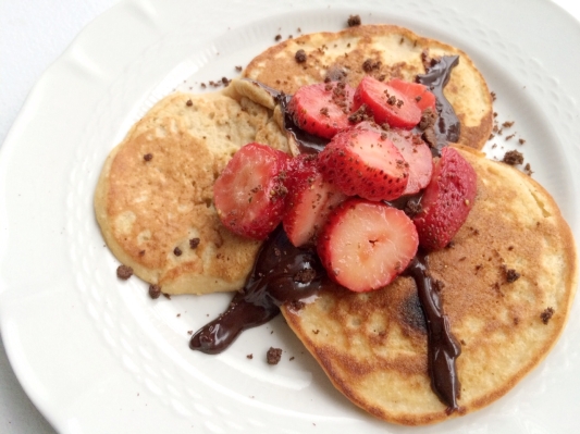 paleo chocolate-covered strawberry pancakes with Mrs. Thinsters brownie batter cookie thin crumbs.